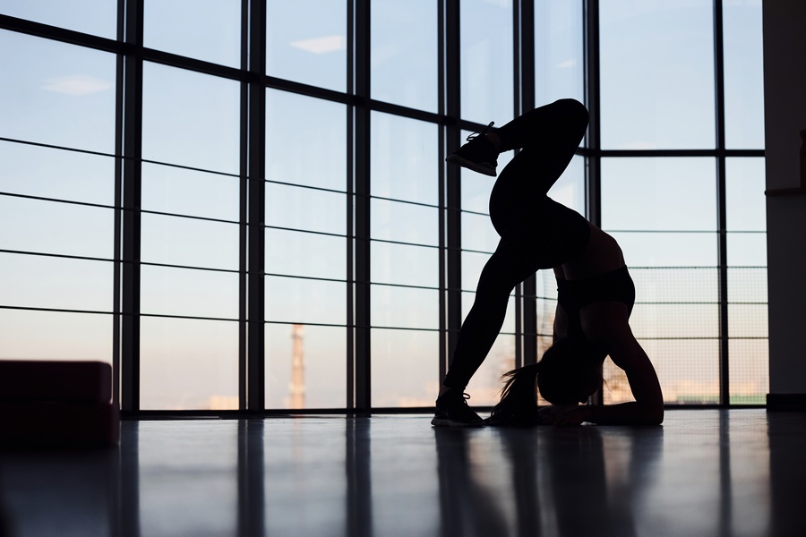 Silhouette Of Young Sporty Woman In Sportswear