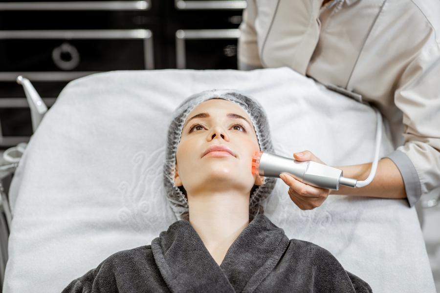 A client receiving a HIFU facial treatment