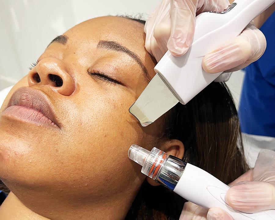 A client receiving a HydroDerma facial treatment